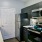 kitchen area on wooden floor with spacious counter-space and designer appliances