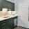 kitchen area on wooden floor with spacious counter-space and designer appliances