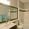 bathroom area with a sink and a stylish faucet